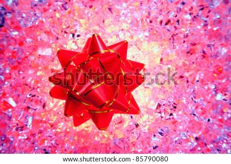 christmas gift ribbon on pink ice background