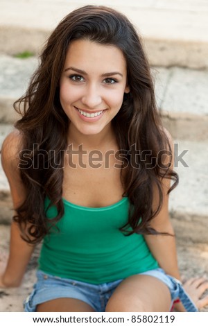 Beautiful young multicultural woman in an outdoor setting.