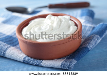 Greek yogurt in a pot Royalty-Free Stock Photo #85815889