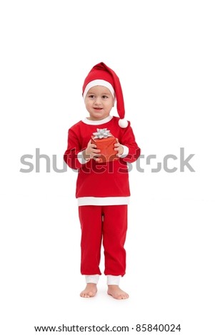 Cute kid in santa costume with gift handheld, smiling.?