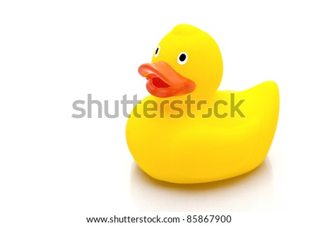 Cute yellow rubber duck isolated over white background Royalty-Free Stock Photo #85867900