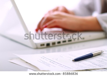 A young businesswoman working on a laptop