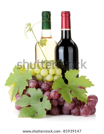 Two wine bottles and grapes. Isolated on white background