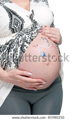 Tummy of pregnant woman with funny drawing over white background