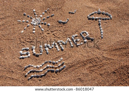 Summer picture from pebble and sand on a beach