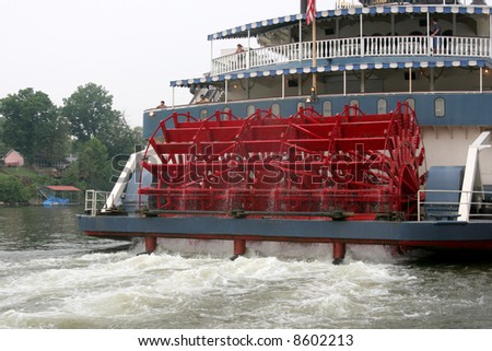 The powerful paddlewheel of a Mississippi Riverboat Royalty-Free Stock Photo #8602213