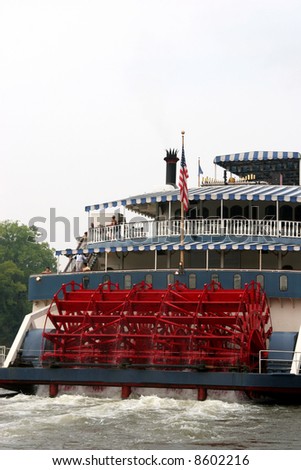The powerful paddlewheel of a Mississippi Riverboat Royalty-Free Stock Photo #8602216