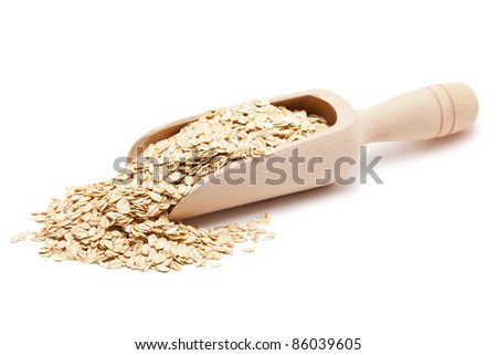 Oat flakes in wooden scoop isolated on white background Royalty-Free Stock Photo #86039605