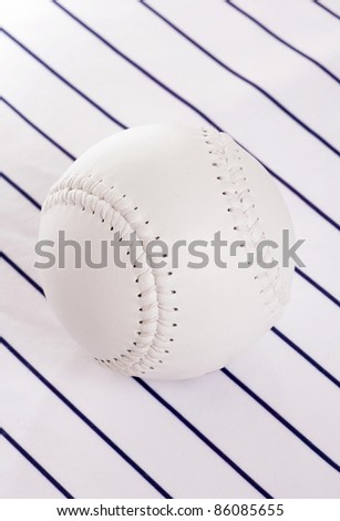 softball on pinstripe background in studio