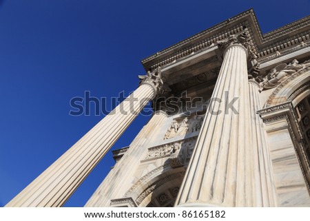 two classical corinth columns over blue sky