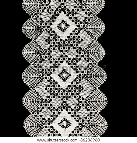 White handmade lace isolated on black Royalty-Free Stock Photo #86206960