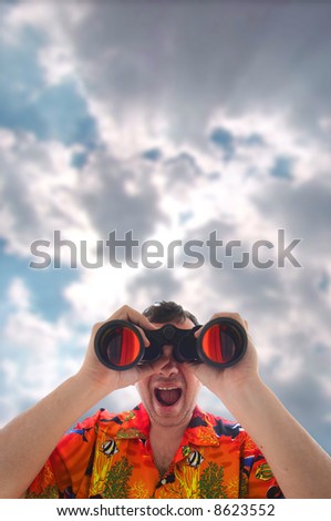 The young man looks in the binocular and smile