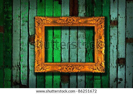 picture frame on vintage green painted wooden wall