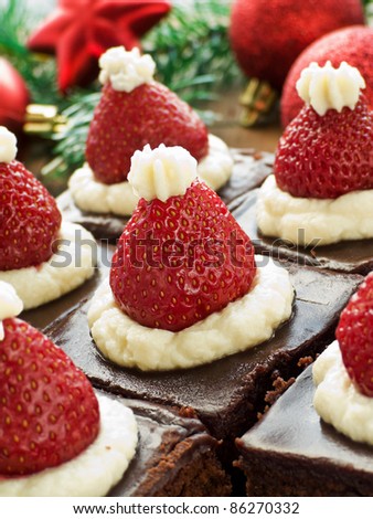 Santa hat brownie bites on the wooden background. Shallow dof.