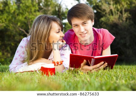 young happy smiling couple in love outside