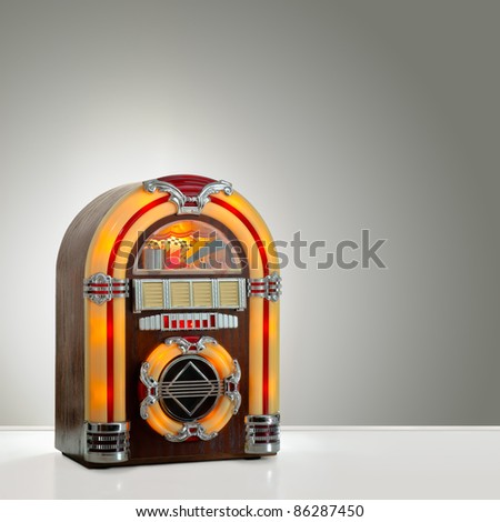 Old retro jukebox in an empty room with nice illumination, copy space ready