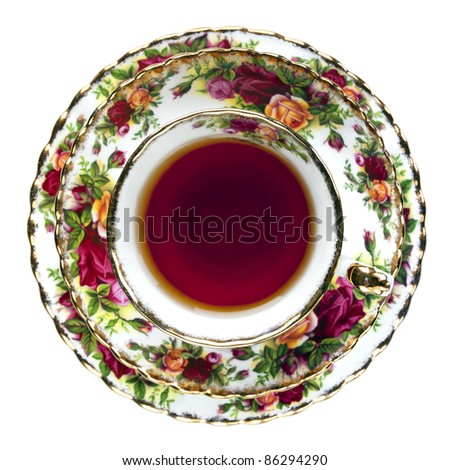 Tea in English fine bone china teacup.  Overhead view, isolated on white. Royalty-Free Stock Photo #86294290