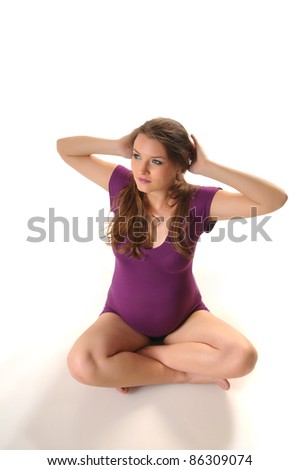 Picture of young pregnant woman doing stretching