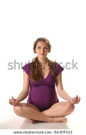 Picture of young pregnant woman doing stretching