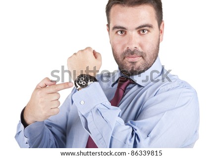 young businessman pointing at his watch over white background