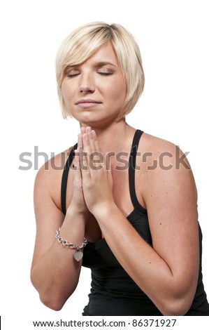 Beautiful Christian woman in a deep prayer