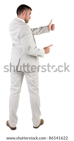 Back view of young business man in white suit going thumb up, isolated on white background. Rear view.Showing of positive emotions with OK sign concept .