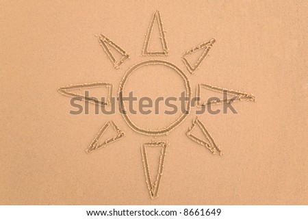 Drawing of the sun done in sand.