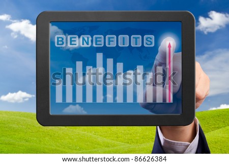 hand pointing higher graph on tablet PC