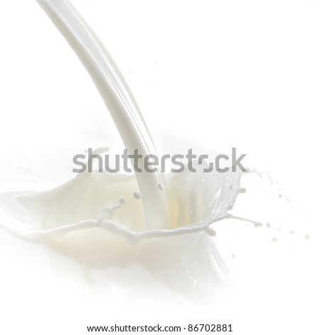 pouring milk splash isolated on white background Royalty-Free Stock Photo #86702881