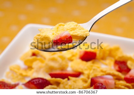 cornflakes with milk and strawberries