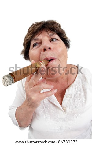 Photo of a woman in her sixties happily smoking a large cuban cigar. Taken with a fisheye lens.