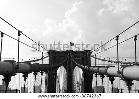 The world famous and historic Brooklyn Bridge located in New York City. Black and white.