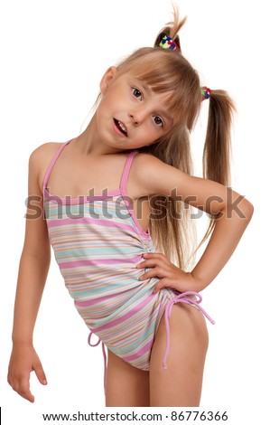 Little beautiful girl wearing pink swimsuit isolated on white background