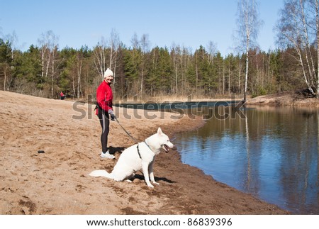 the sports woman with a dog