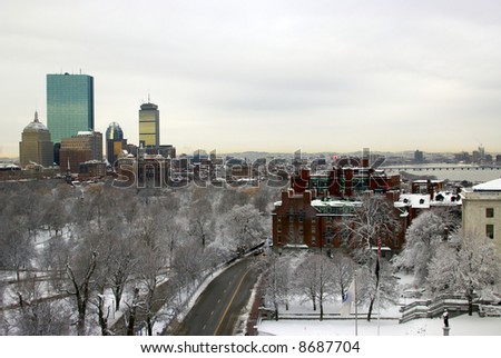 boston landscape after a snowstorm, can see beacon street, boston commons, skyscrapers, charles river