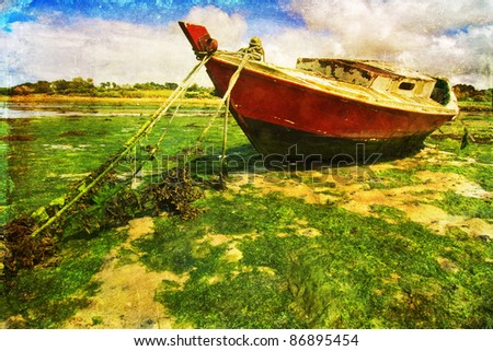 retro colored picture of an abandoned boat at the coast