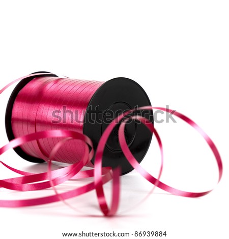 bobbin of pink ribbon for gift. Image over white background