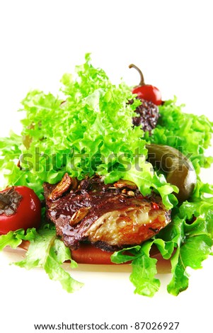 beef meat served on fresh raw green salad