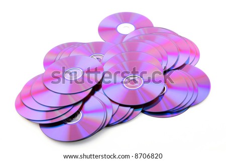 Pile of colorful purple DVDs or CDs on white background. No dust.