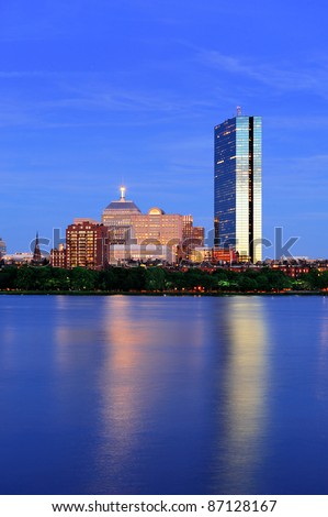 Boston Charles River at dusk with urban city skyline and light reflection