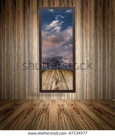 wooden photo frame on old wooden wall