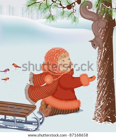 Little girl feeding a squirrel at winter park