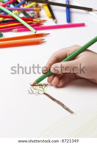 child drawing tree, colorful pencils