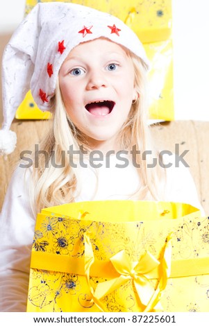 Happy little girl with gift