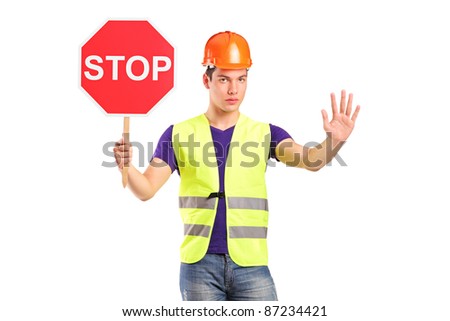 A construction worker holding a traffic sign stop isolated on white background