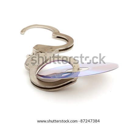 Cd with handcuffs isolated on white background