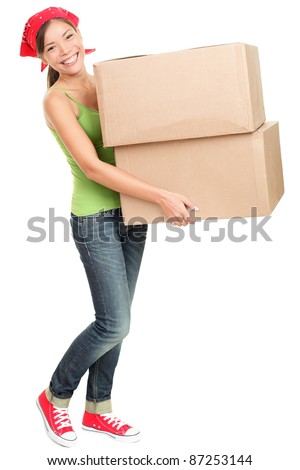 Woman carrying moving boxes. Young woman moving house to new home holding cardboard boxes isolated on white background standing in full length.