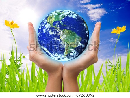 hand holding earth, saving earth concept. Earth globe image provided by NASA Royalty-Free Stock Photo #87260992