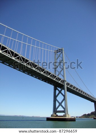 Bay Bridge spanning San Francisco Bay viewed from the water.