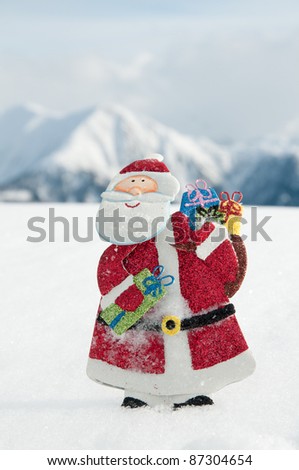 Merry Christmas - Santa Claus is coming, snowy mountains in background